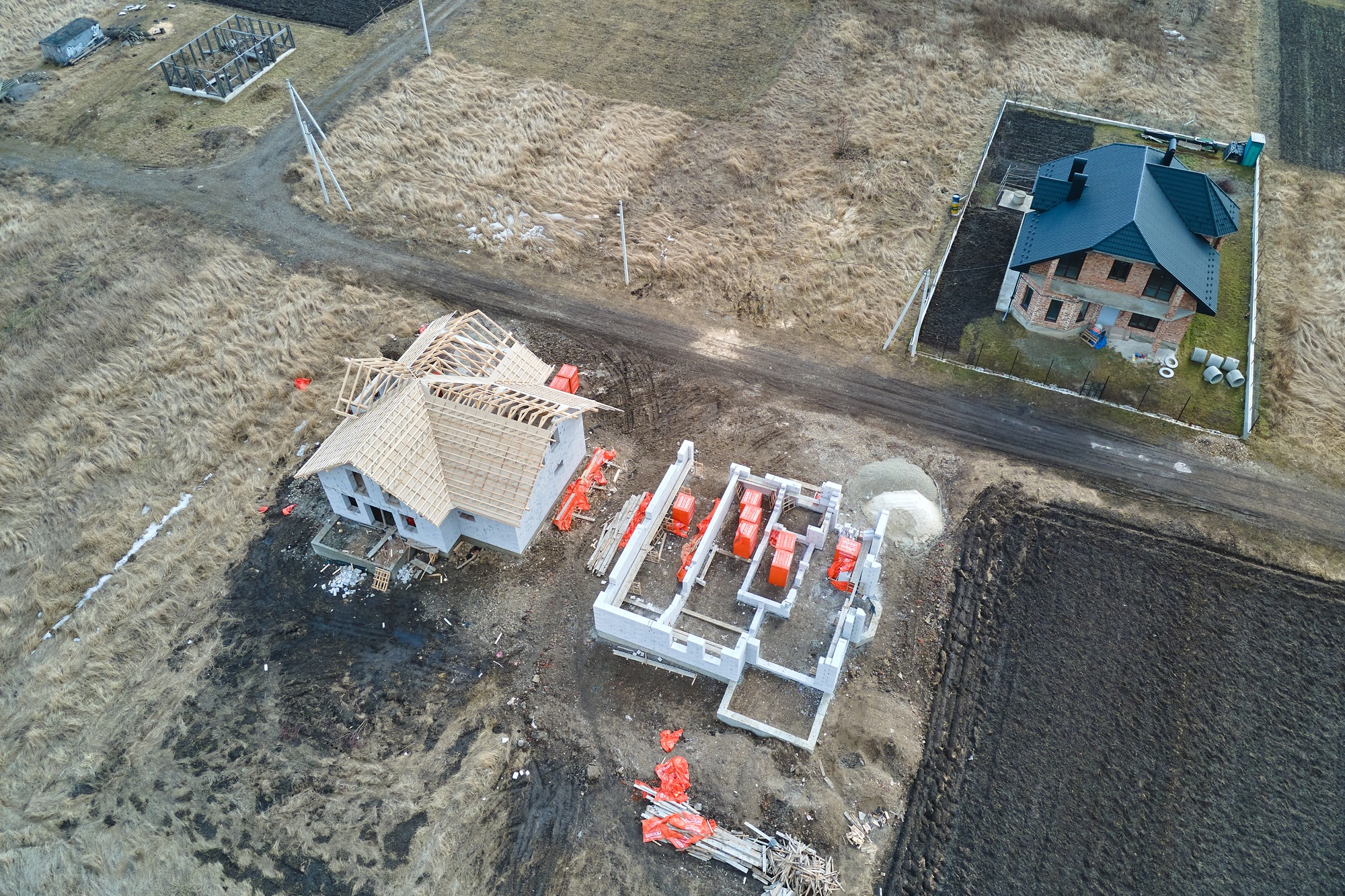 Aerial view of unfinished frame of private house foundation under construction