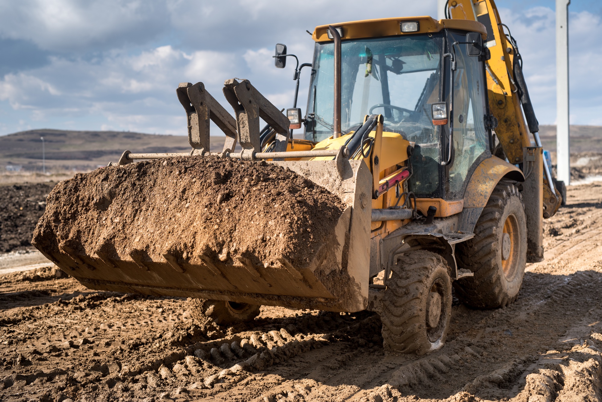 Close up details of industrial backhoe loader