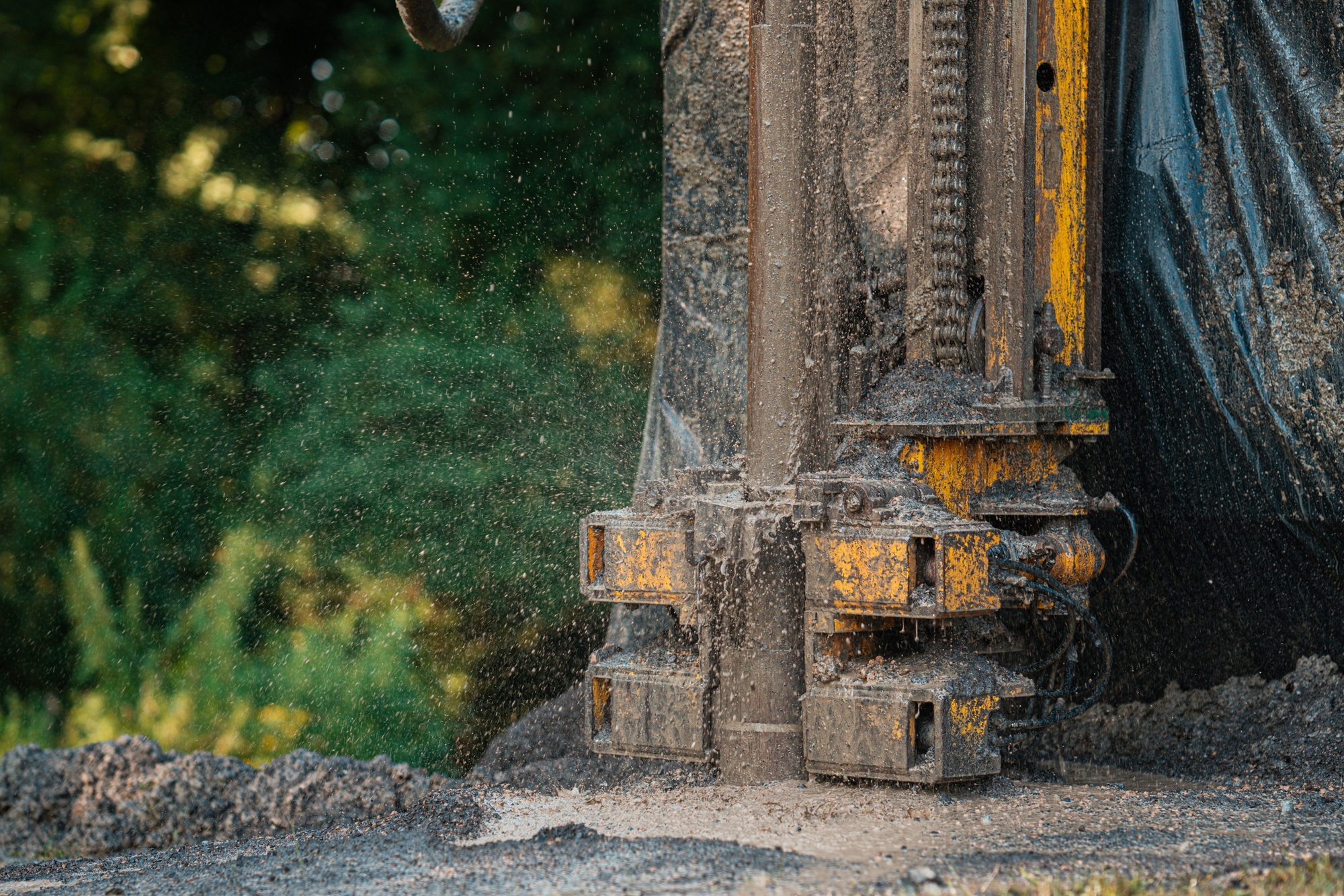Close up of well drilling rig boring dowin into the earth.