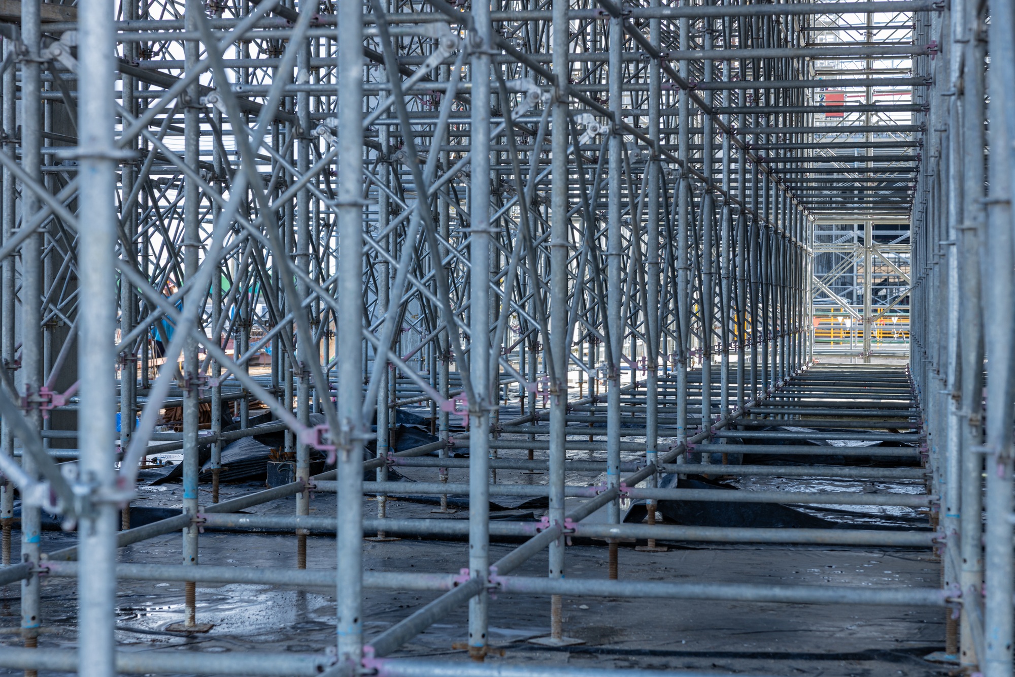 High scaffolding structure under construction beams