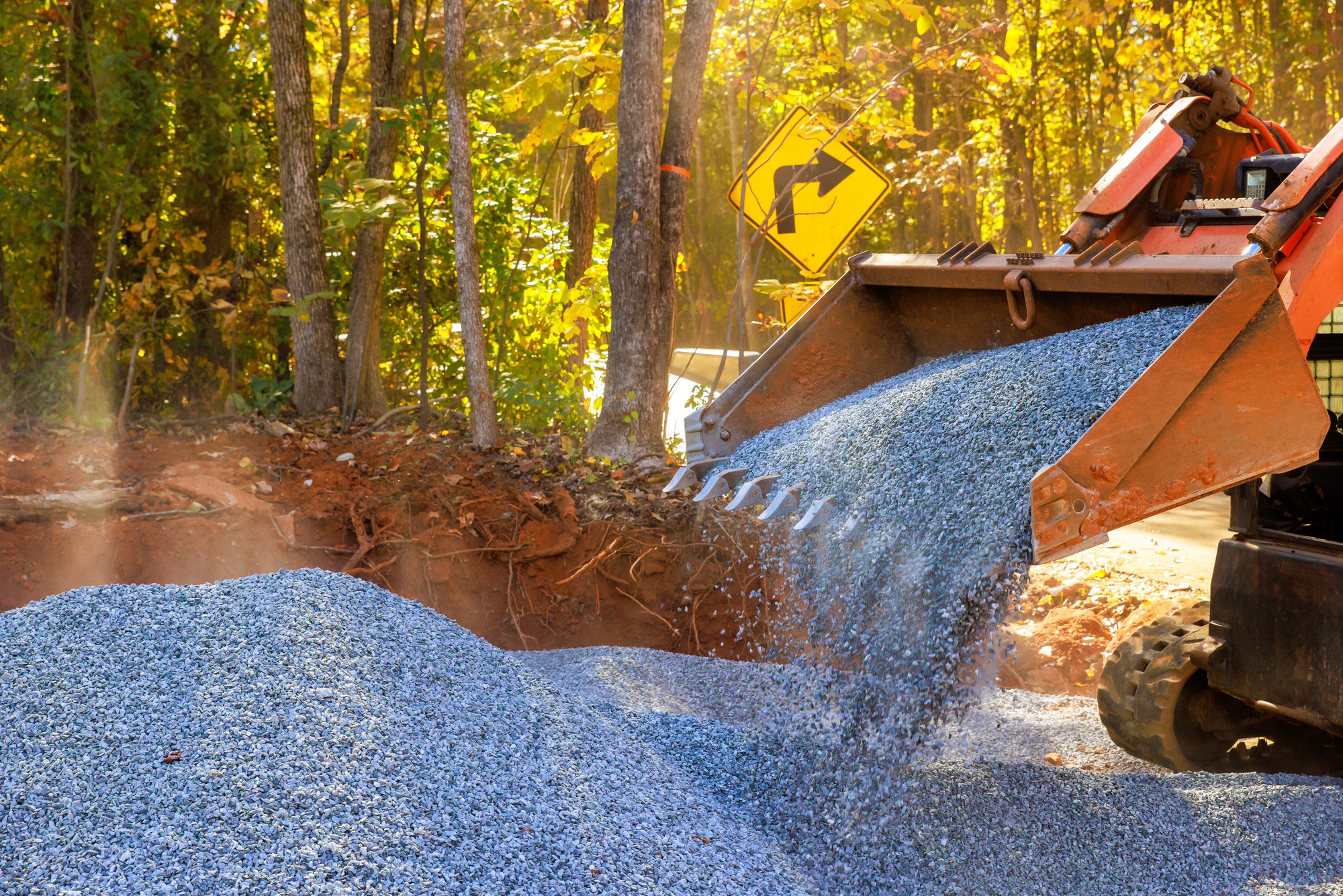 It is a lot of work to prepare basis for new road by laying crushed stone gravel filled with crushed