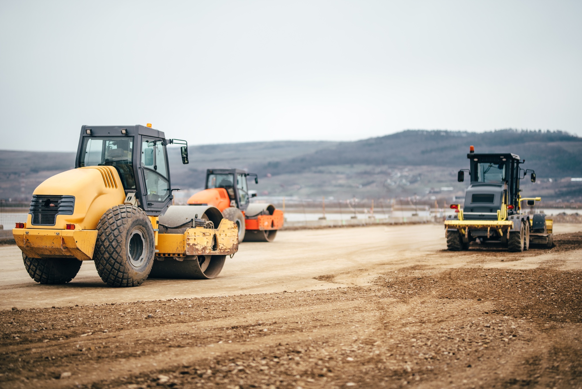 Vibratory Soil Compactors on highway construction site